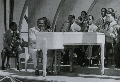 Image of Count Basie on the set 'Crazy House', Hollywood 1943.
