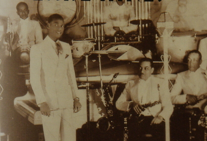 Image of L-r. George Dixon, Earl Hines, Wallace Bishop, Omer Simeon, Jimmy Mundy at the Grand Terrace Cafe, Chicago, 1932.